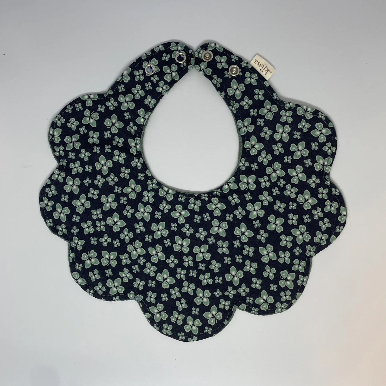 Midnight Clover flower bib, front