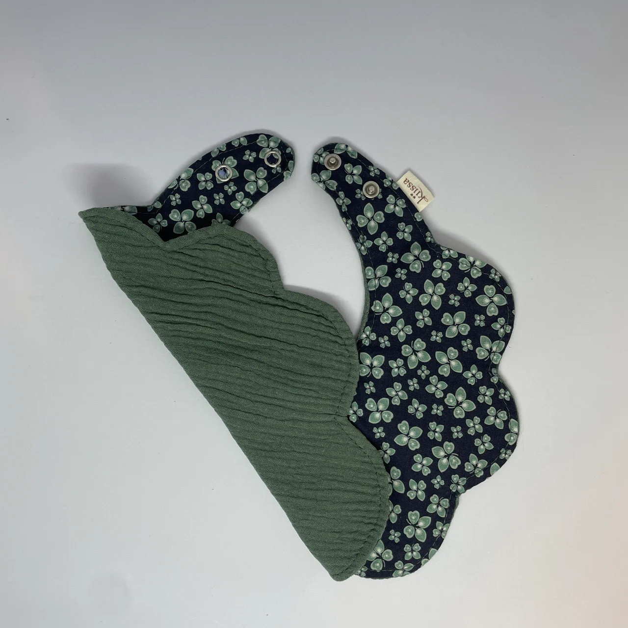 Midnight Clover bib turned over to show its backing